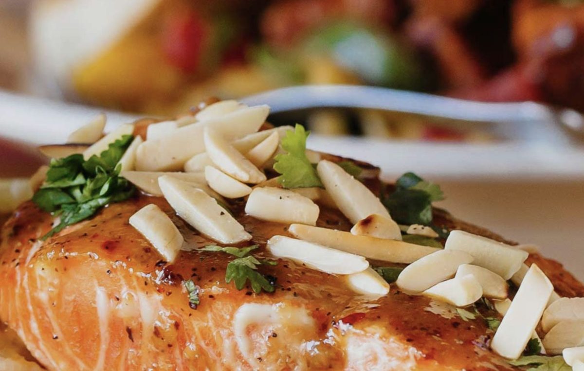 Cooked Salmon with almond shavings on top