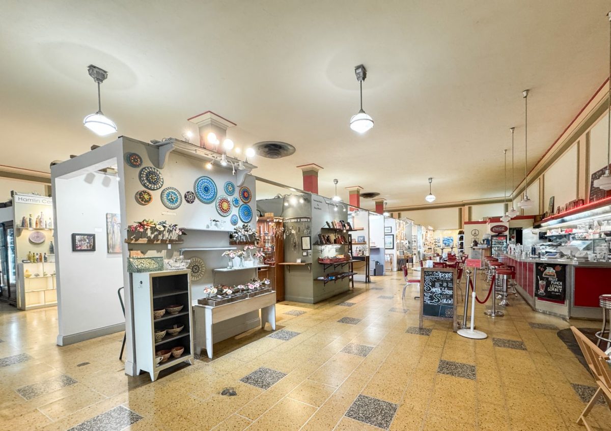 Interior of Woolworth Walk in downtown Asheville, NC, featuring local art displays, handmade crafts, and a vintage-style soda fountain counter inside the historic Woolworth building.