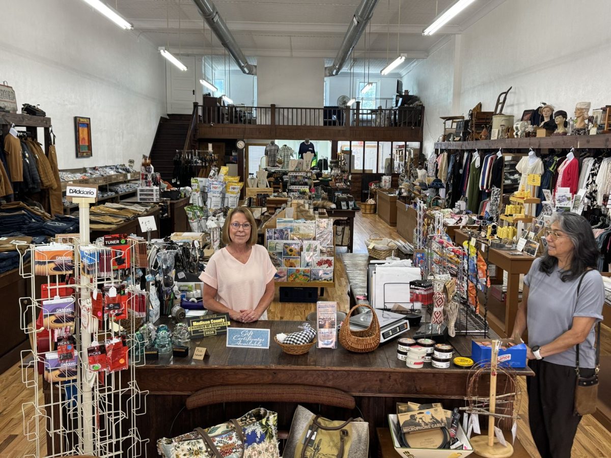 Interior of Penland & Sons Department Store in downtown Marshall, North Carolina, with friendly staff behind the counter and a wide selection of clothing, gifts, accessories, local products, and everyday essentials.