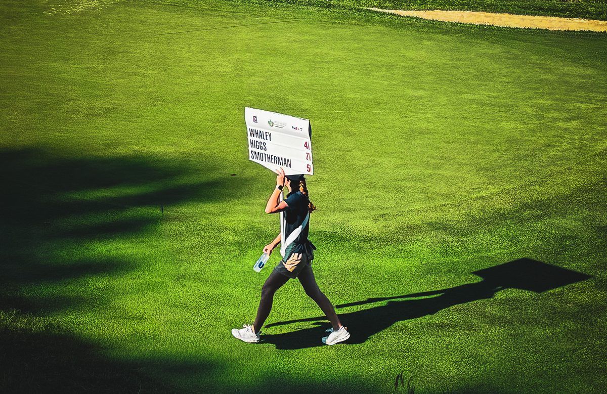 Walking scoreboard carrier displays the names and scores of PGA TOUR golfers Whaley, Higgs, and Smotherman during the 2026 Biltmore Championship Asheville at The Cliffs at Walnut Cove.